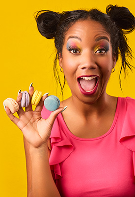 Fun and exciting headshot for a macaron bakery shot by Jason Usher for marketing purposes.